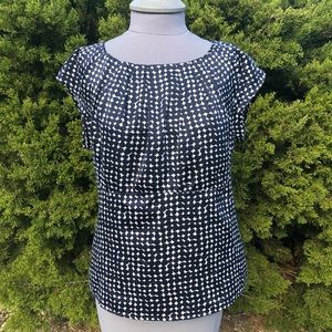 Navy polka dot blouse